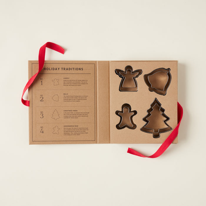 A set of eight holiday-themed cookie cutters, packaged together as a gift.